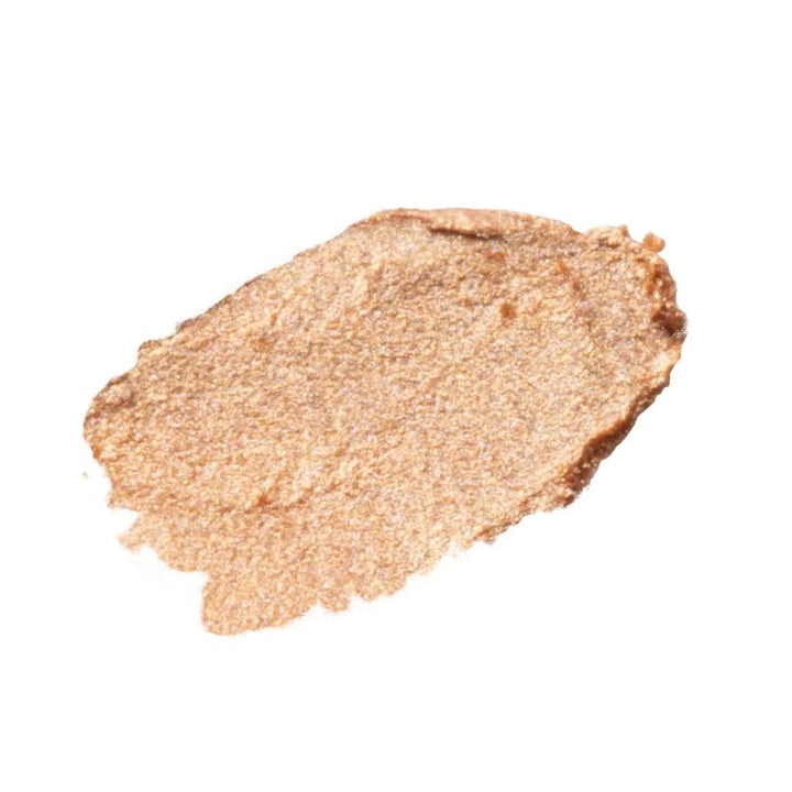 ISSADA Conceal & Highlight Duo swatch in Golden Hour shade, radiant golden highlighter with luminous finish on a white background