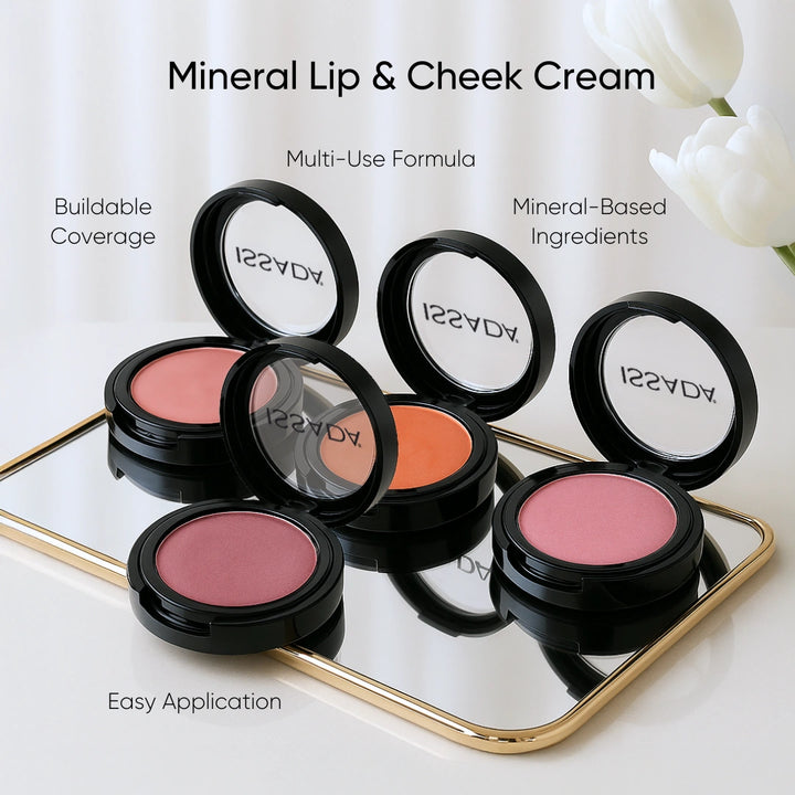 Issada Mineral Lip & Cheek Cream compacts in multiple shades displayed on a mirrored tray, showcasing buildable coverage, easy application, multi-use formula, and mineral-based ingredients for a natural, glowing finish.