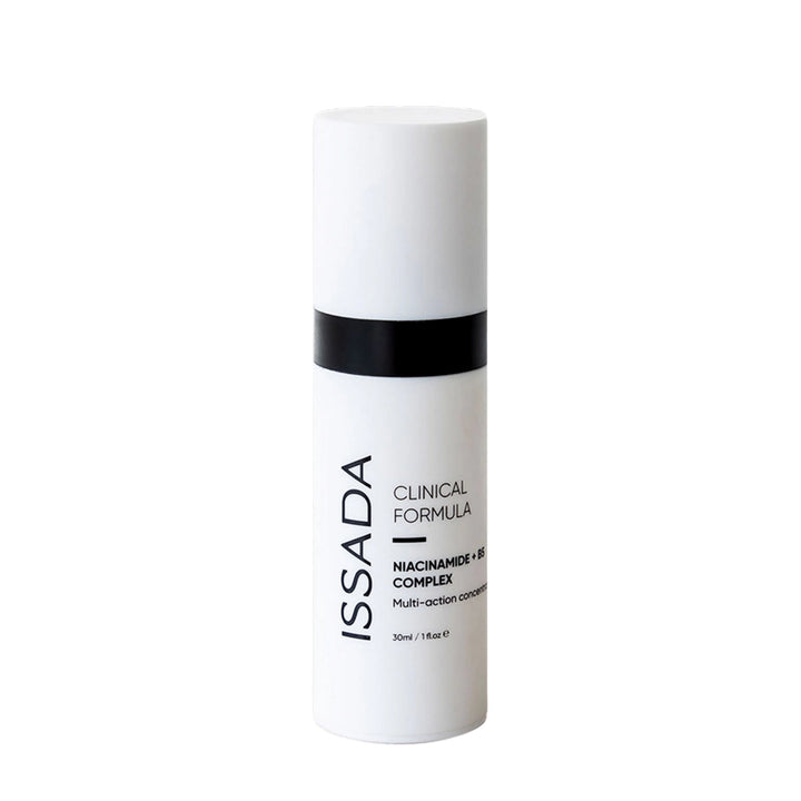 Issada Niacinamide + B5 Complex serum bottle from the Clinical Formula range, featuring a sleek white design with black detailing, showcasing the multi-action skincare concentrate.