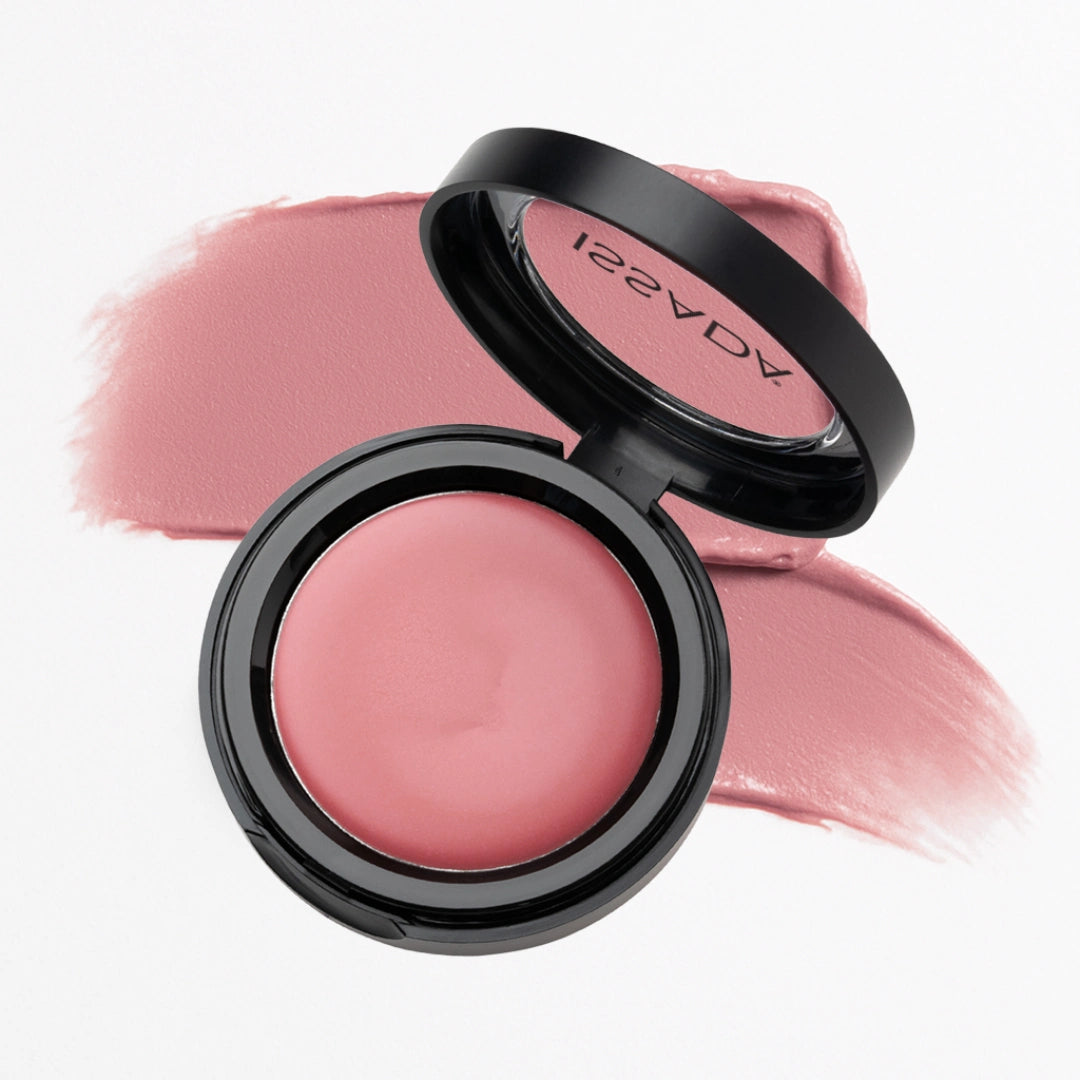 Issada Mineral Lip & Cheek Cream in Raspberries Cream, a soft pink-rose shade, displayed open with a matching color swatch behind the compact. Issada Mineral Lip & Cheek Cream in Raspberries Cream, a soft pink-rose shade, displayed open with a matching color swatch behind the compact.