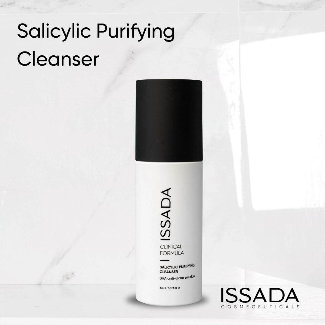 Issada Salicylic Purifying Cleanser product bottle standing against a marble background, showcasing its sleek minimalist design. Issada Salicylic Purifying Cleanser product bottle standing against a marble background, showcasing its sleek minimalist design.