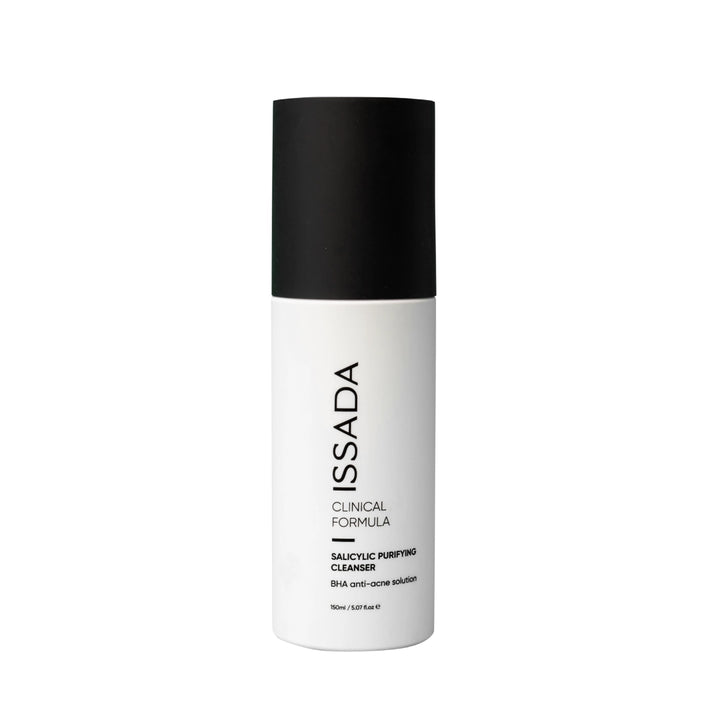Issada Salicylic Purifying Cleanser in a white bottle with black cap, labeled as BHA anti-acne solution, displayed on a plain white background.