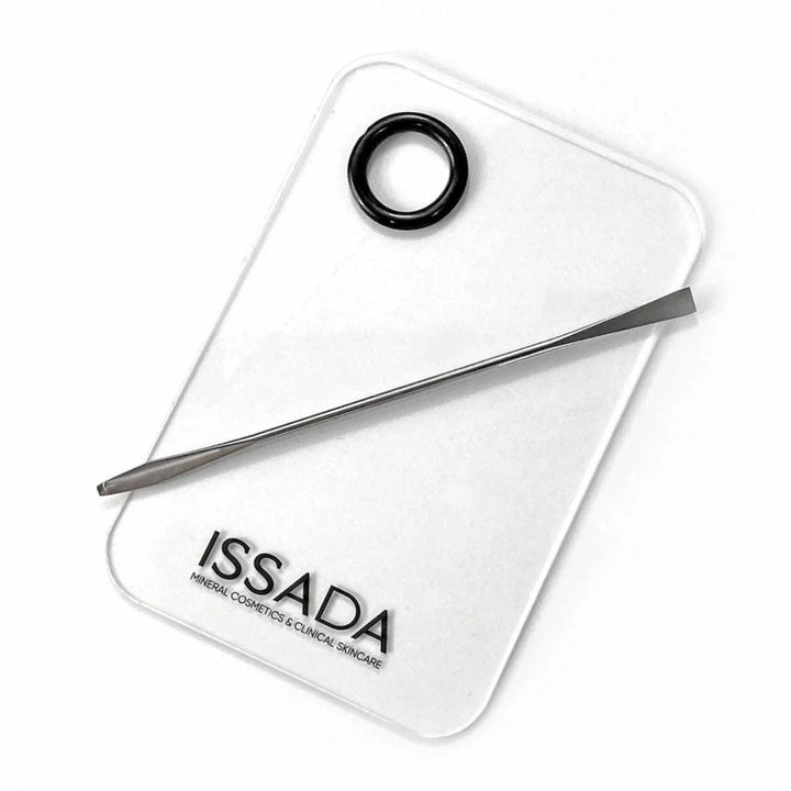 Issada artist mixing palette with spatula for blending and customizing makeup products.