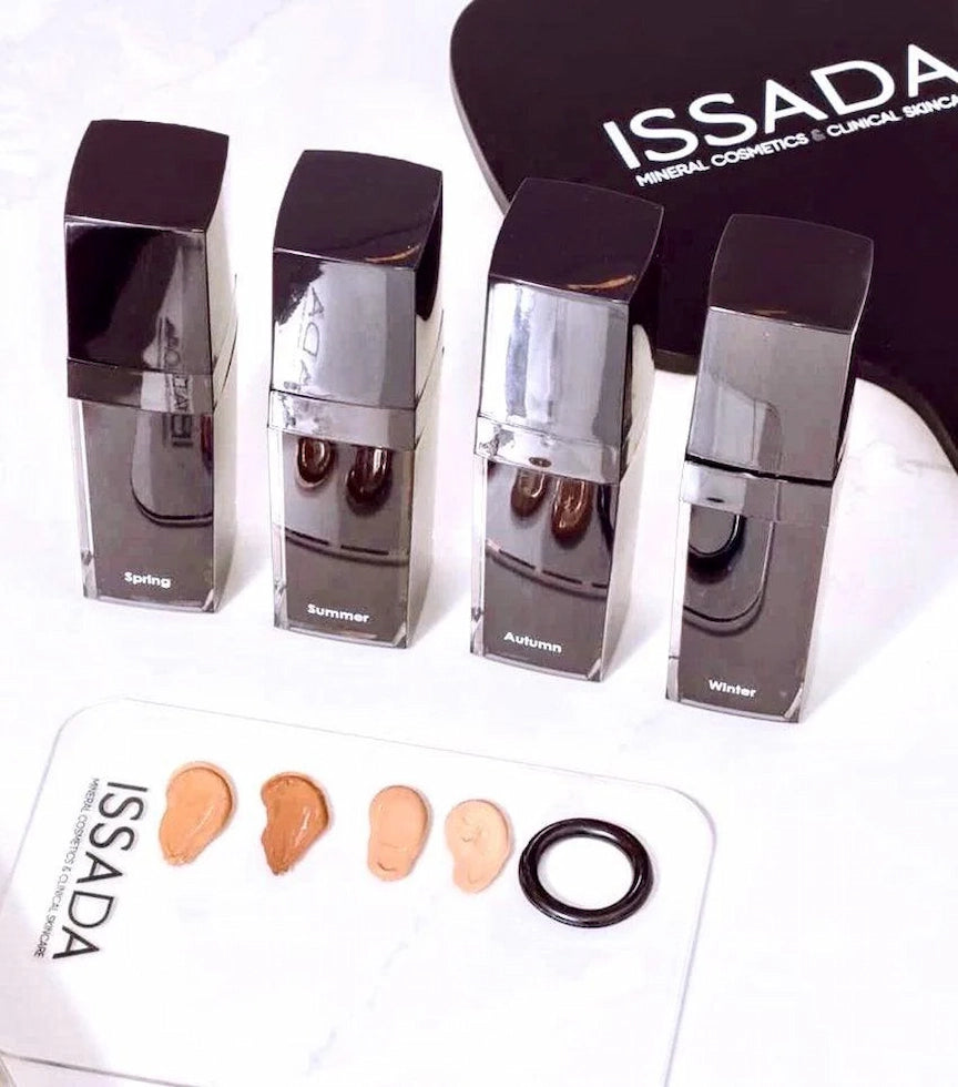 Issada artist mixing palette with spring, summer, autumn, and winter foundation shades blended for custom skin tone matching.