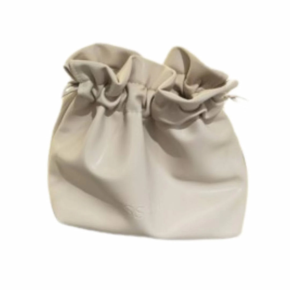 Issada cream drawstring cosmetic pouch for makeup and skincare storage.