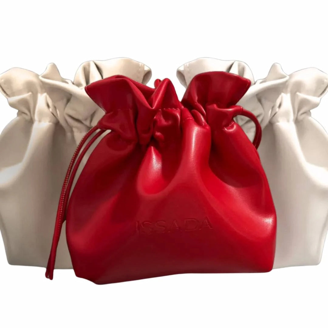 Issada luxury drawstring cosmetic bags in red and cream, perfect for makeup or skincare storage.