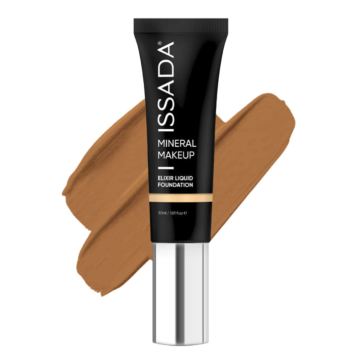 ISSADA Mineral Makeup Elixir Liquid Foundation in 15 warm shade tube with a swatch on a white background
