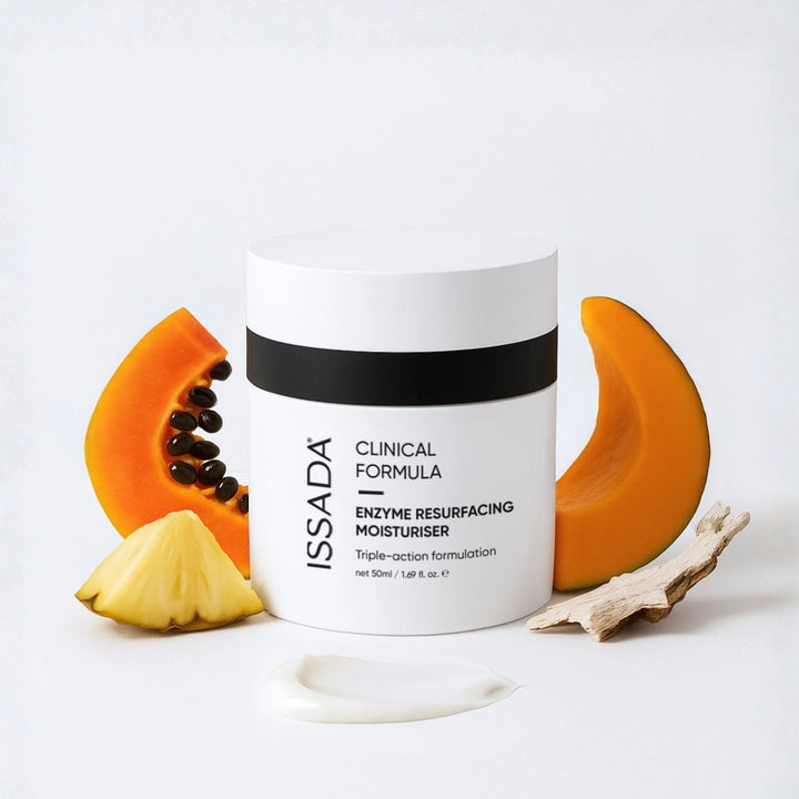 ISSADA Enzyme Resurfacing Moisturiser jar with papaya, pineapple, pumpkin and a cream swatch on a white background.