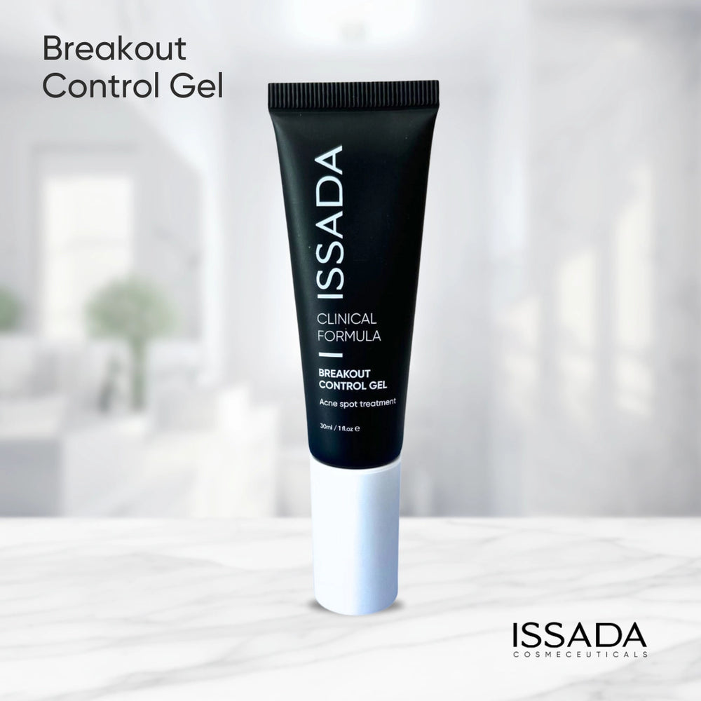 ISSADA Breakout Control Gel displayed on a marble surface, a clinical acne spot treatment designed to clarify and balance the skin.