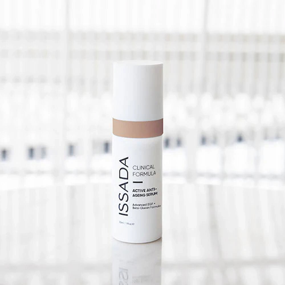 ISSADA Active Anti-ageing Serum with beta Glucan and advanced EGF bottle on a blurred background