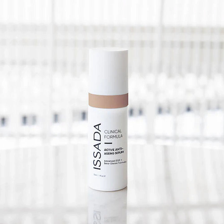 ISSADA Active Anti-ageing Serum with beta Glucan and advanced EGF bottle on a blurred background
