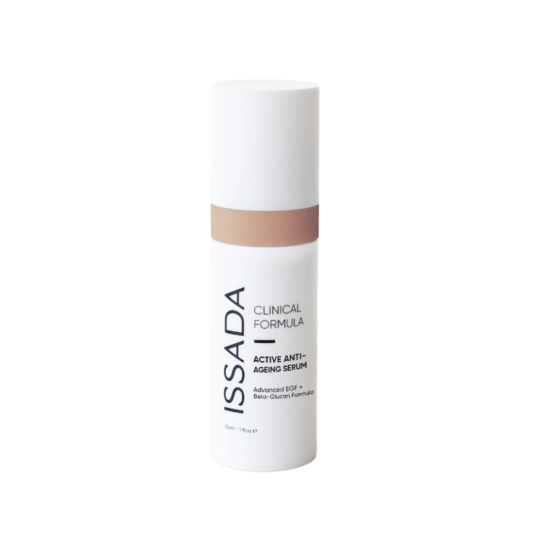 Issada Active Anti-Ageing Serum in a white bottle with beige accent and black text on a plain white background.