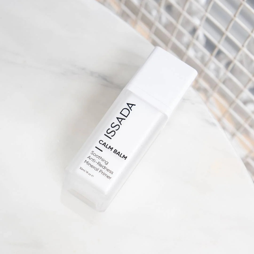 Issada Calm Balm Soothing Anti-redness Mineral Primer on marble background, lightweight calming makeup base for sensitive skin