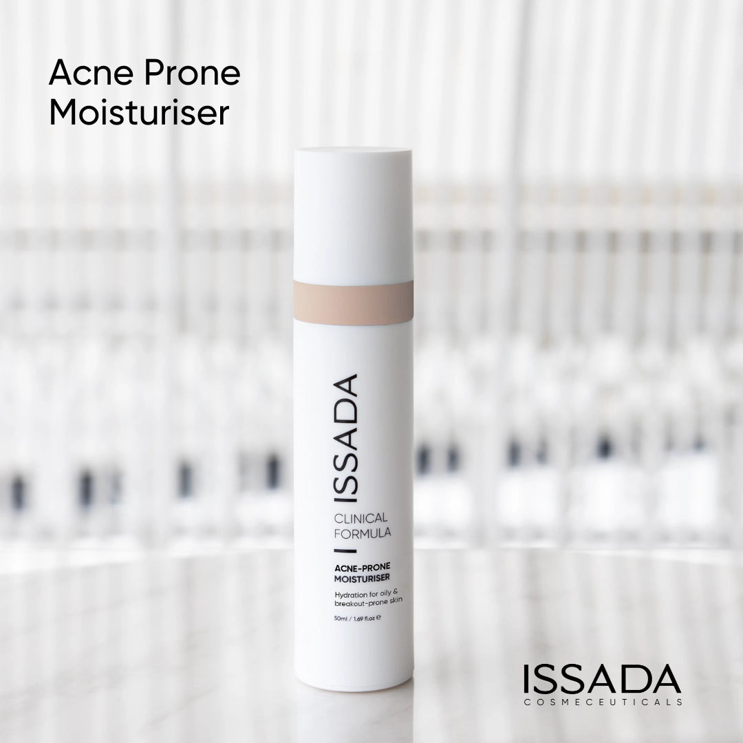 ISSADA Clinical Formula Acne-Prone Moisturiser displayed on a marble surface, a lightweight hydrating formula designed for oily and breakout-prone skin.