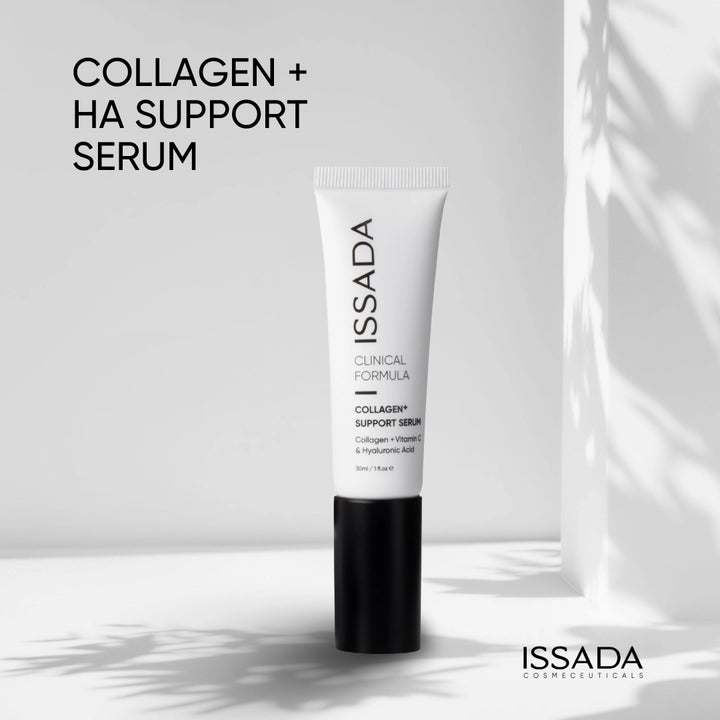 Issada Collagen+ HA Support Serum standing on a minimalist surface with soft natural shadows showcasing its sleek clinical design and brightening skincare formula