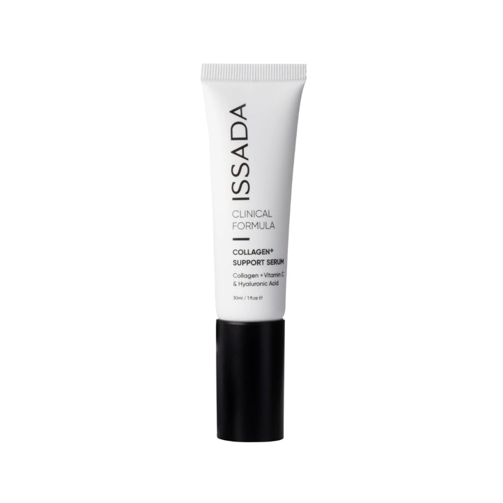 Issada Collagen+ Support Serum tube standing upright, featuring a sleek white and black design with Collagen, Vitamin C, and Hyaluronic Acid formula details.