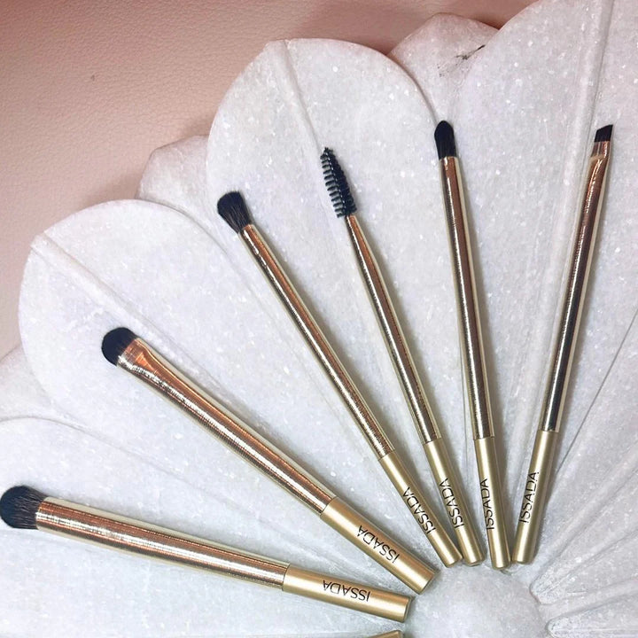 Issada Gold Professional Eye Brush Set featuring shadow, smudge, spoolie, angled, and precision brushes with luxe gold handles.