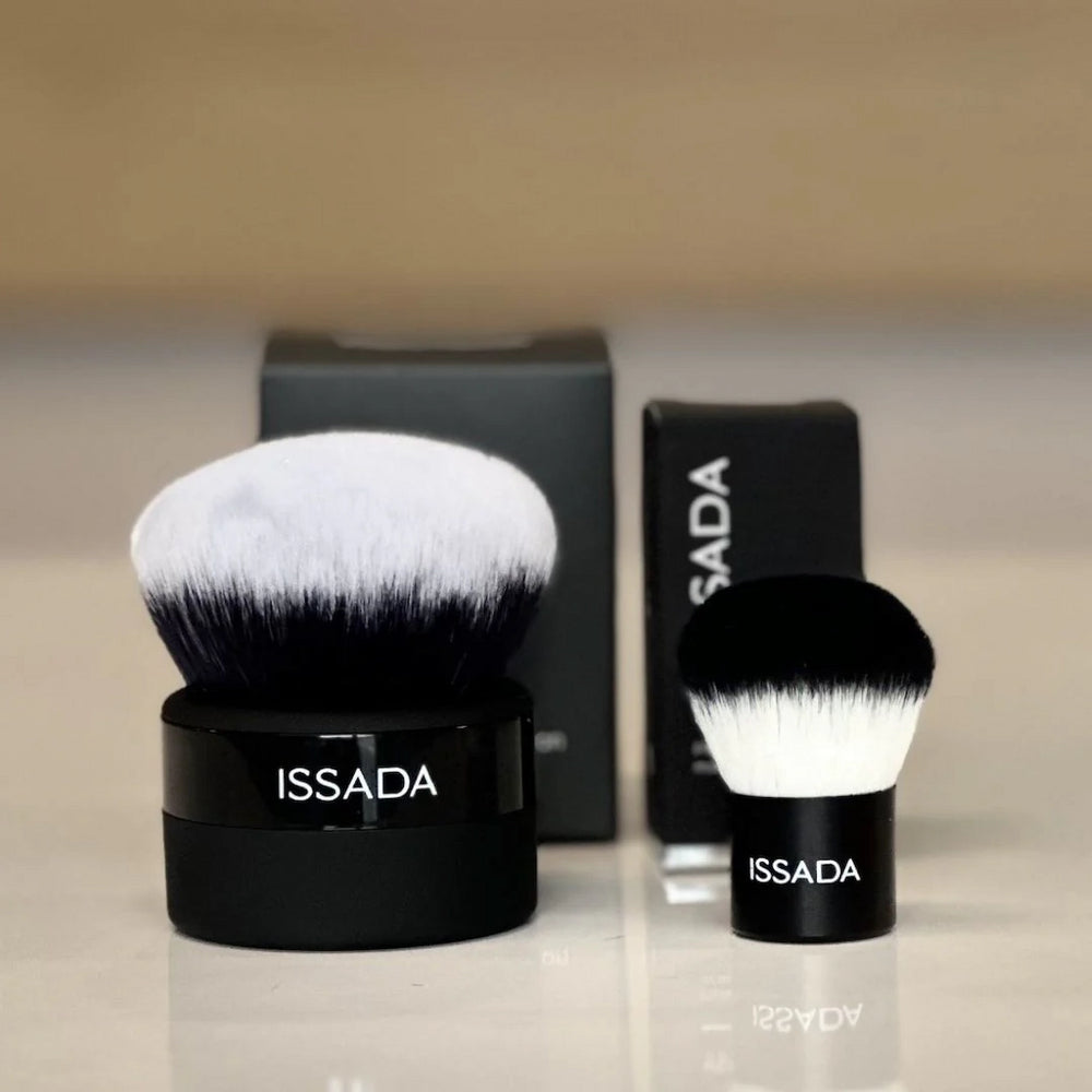Issada Kabuki Brush size comparison showing large and mini vegan kabuki brushes with dense, soft bristles for mineral makeup application.
