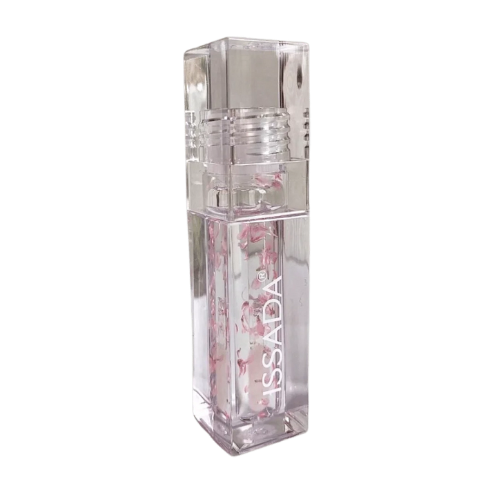 ISSADA Lip Oil in Blossom, a nourishing clear lip oil infused with real flower petals to hydrate, soften, and add natural shine to lips.