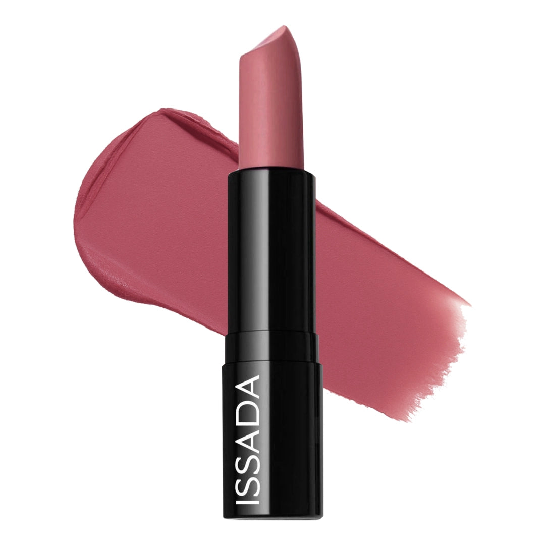 Issada Mineral Cream Lipstick in Magic Mauve shade with a creamy mauve swatch behind the tube, showing its smooth, hydrating texture and rich colour payoff.