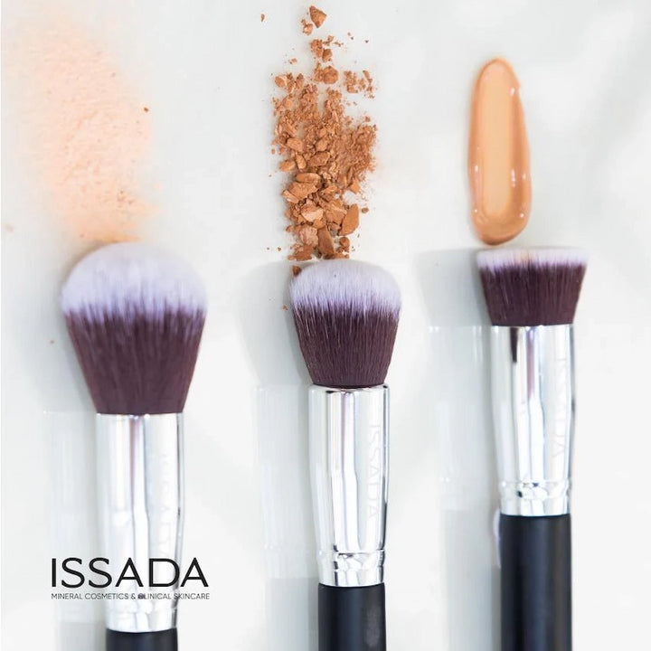 Issada vegan makeup brushes with powder, bronzer, and liquid foundation swatches, designed for flawless mineral makeup application.