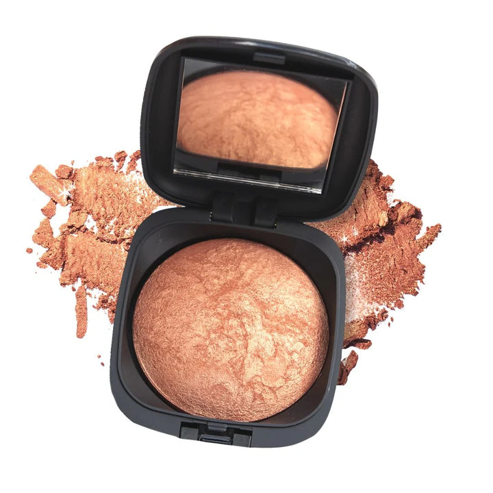ISSADA Mineral Beach Babe bronzer with mirror and scattered powder on a white background