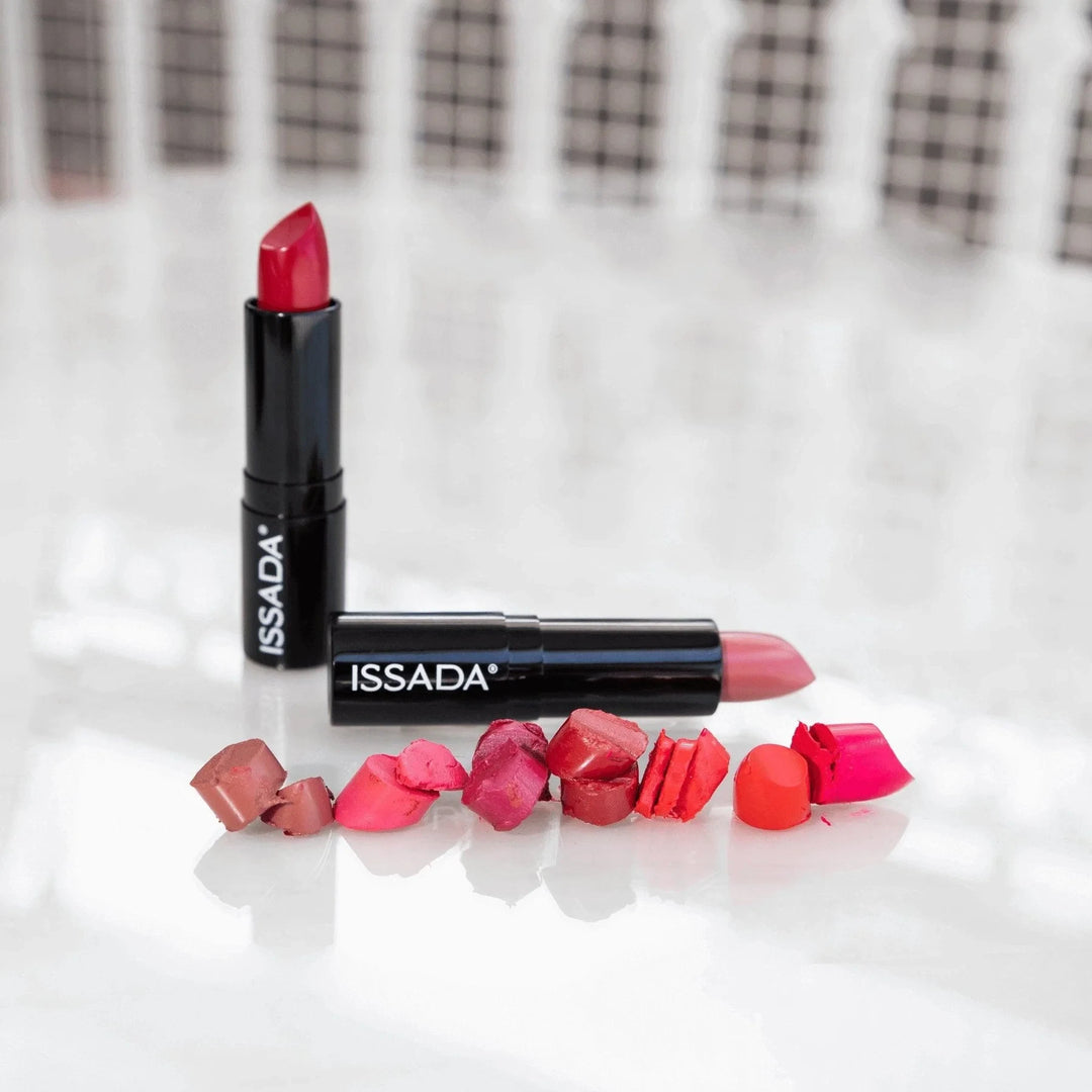 Collection of ISSADA Mineral Cream Lipstick in various bold shades with creamy texture, displayed with cut swatches
