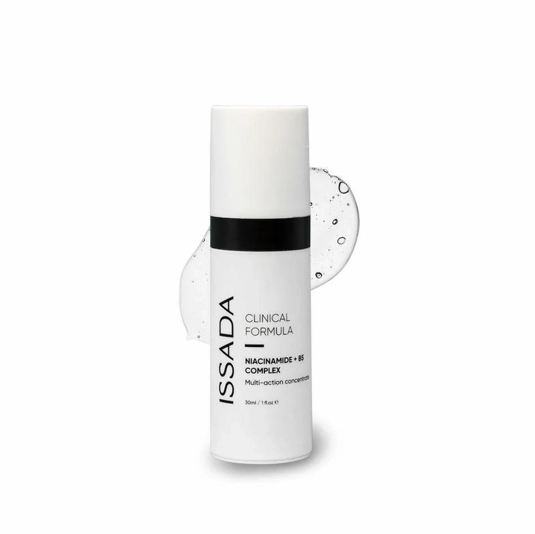 ISSADA Niacinamide + B5 Complex Serum with clear serum smear on a white background