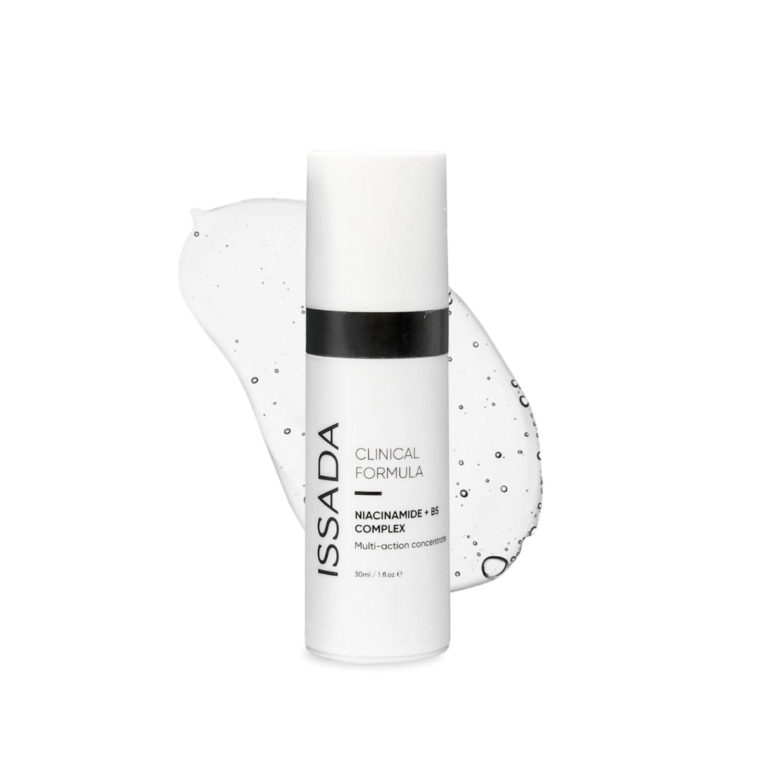 Issada Niacinamide + B5 Complex serum bottle displayed with a clear gel-like swatch background, highlighting the lightweight, hydrating texture of the multi-action skincare formula.