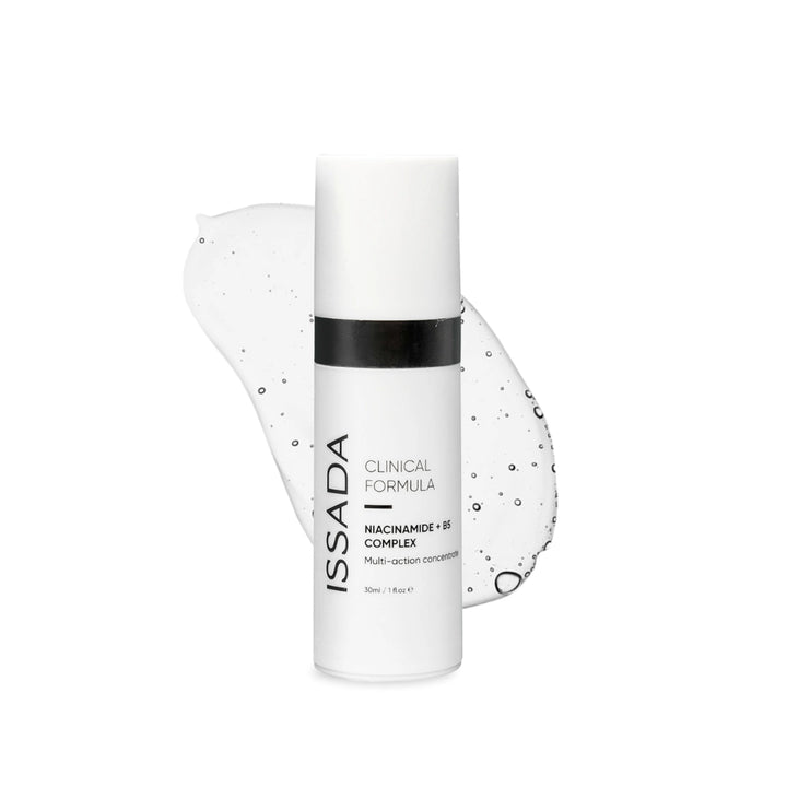 Issada Niacinamide + B5 Complex serum bottle displayed with a clear gel-like swatch background, highlighting the lightweight, hydrating texture of the multi-action skincare formula.