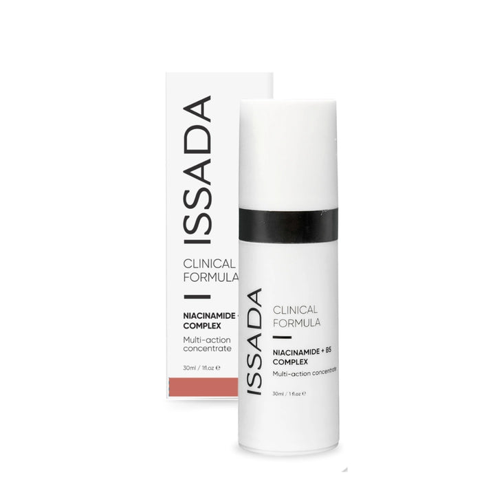 Issada Niacinamide + B5 Complex serum bottle displayed alongside its matching product box, showcasing the Clinical Formula packaging design for the multi-action skincare concentrate.