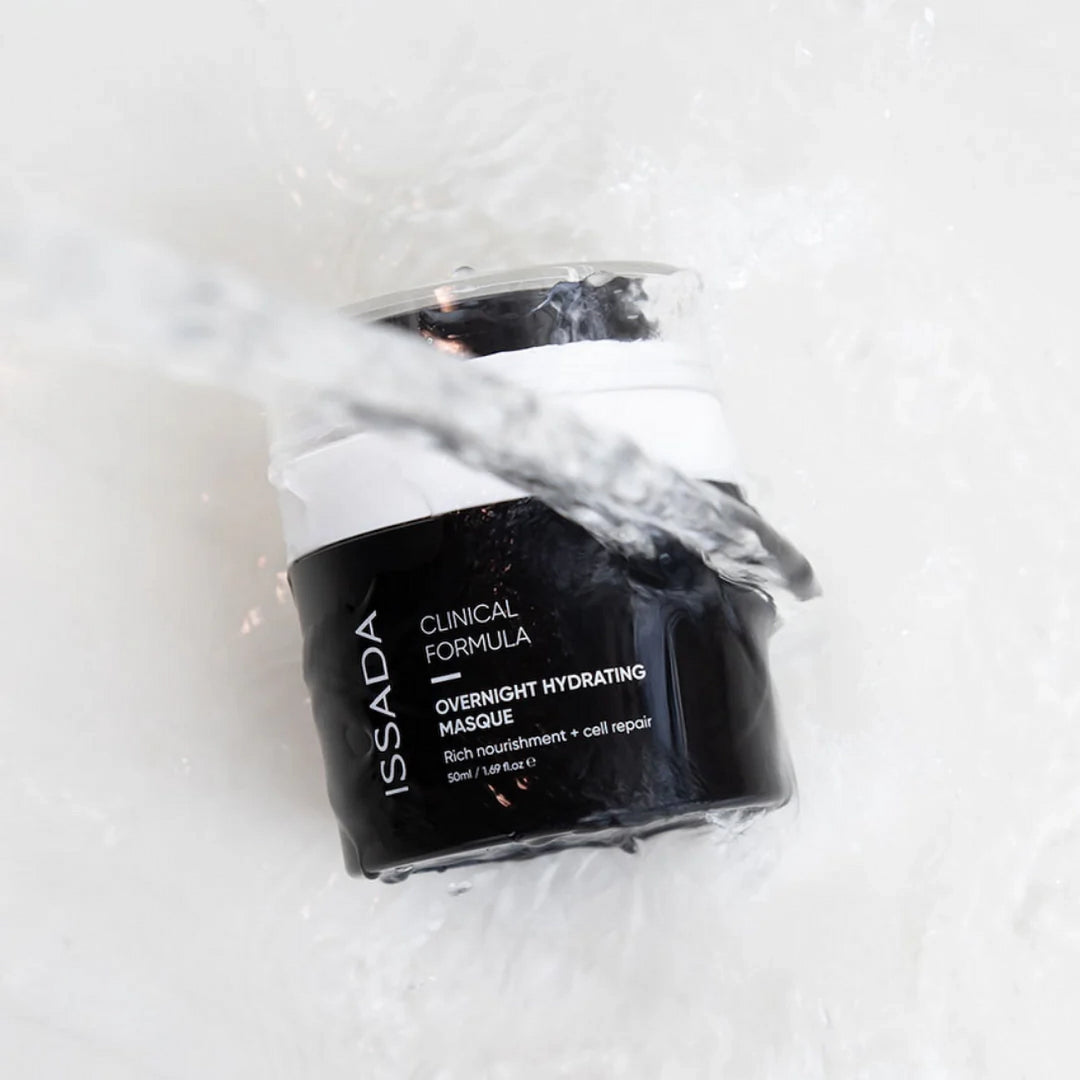 ISSADA Overnight Hydrating Masque jar in water splash on a white background