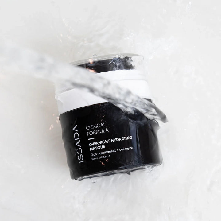 ISSADA Overnight Hydrating Masque jar in water splash on a white background