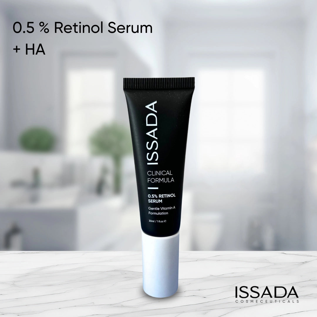 ISSADA Clinical Formula 0.5% Retinol Serum with Hyaluronic Acid displayed on a marble surface, a gentle Vitamin A treatment designed to refine texture and boost hydration.