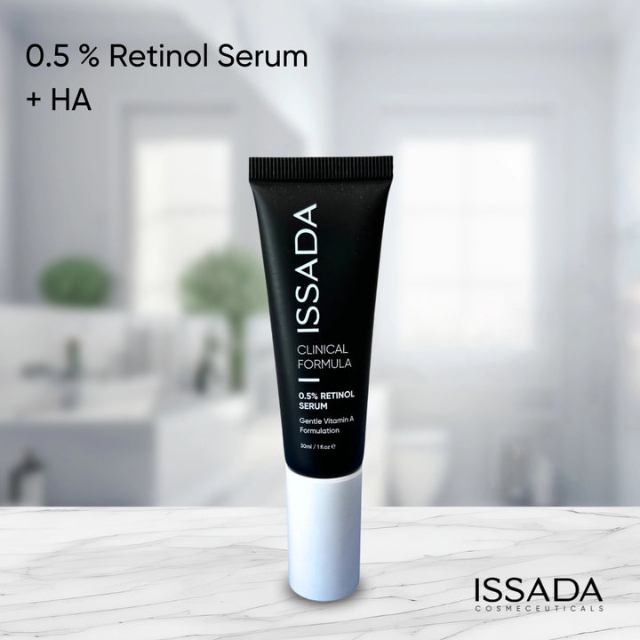 ISSADA Clinical Formula 0.5% Retinol Serum with Hyaluronic Acid displayed on a marble surface, a gentle Vitamin A treatment designed to refine texture and boost hydration.