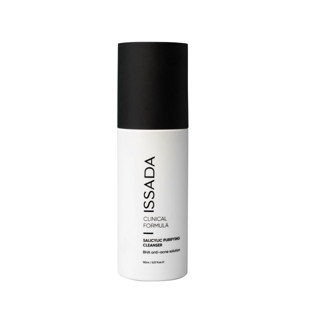 Issada Salicylic Purifying Cleanser in a white bottle with black cap, labeled as BHA anti-acne solution, displayed on a plain white background.