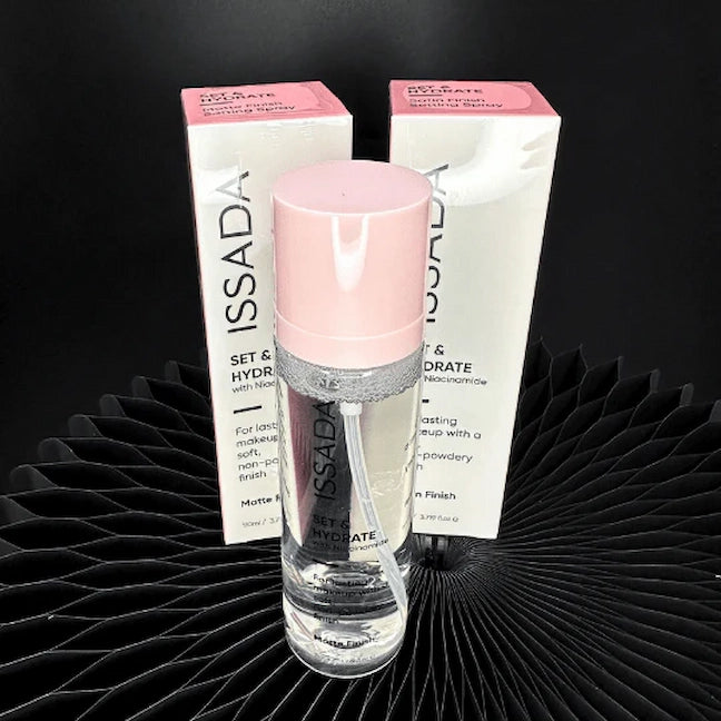 ISSADA Set & Hydrate matte finish setting spray with niacinamide and product box on a black textured surface