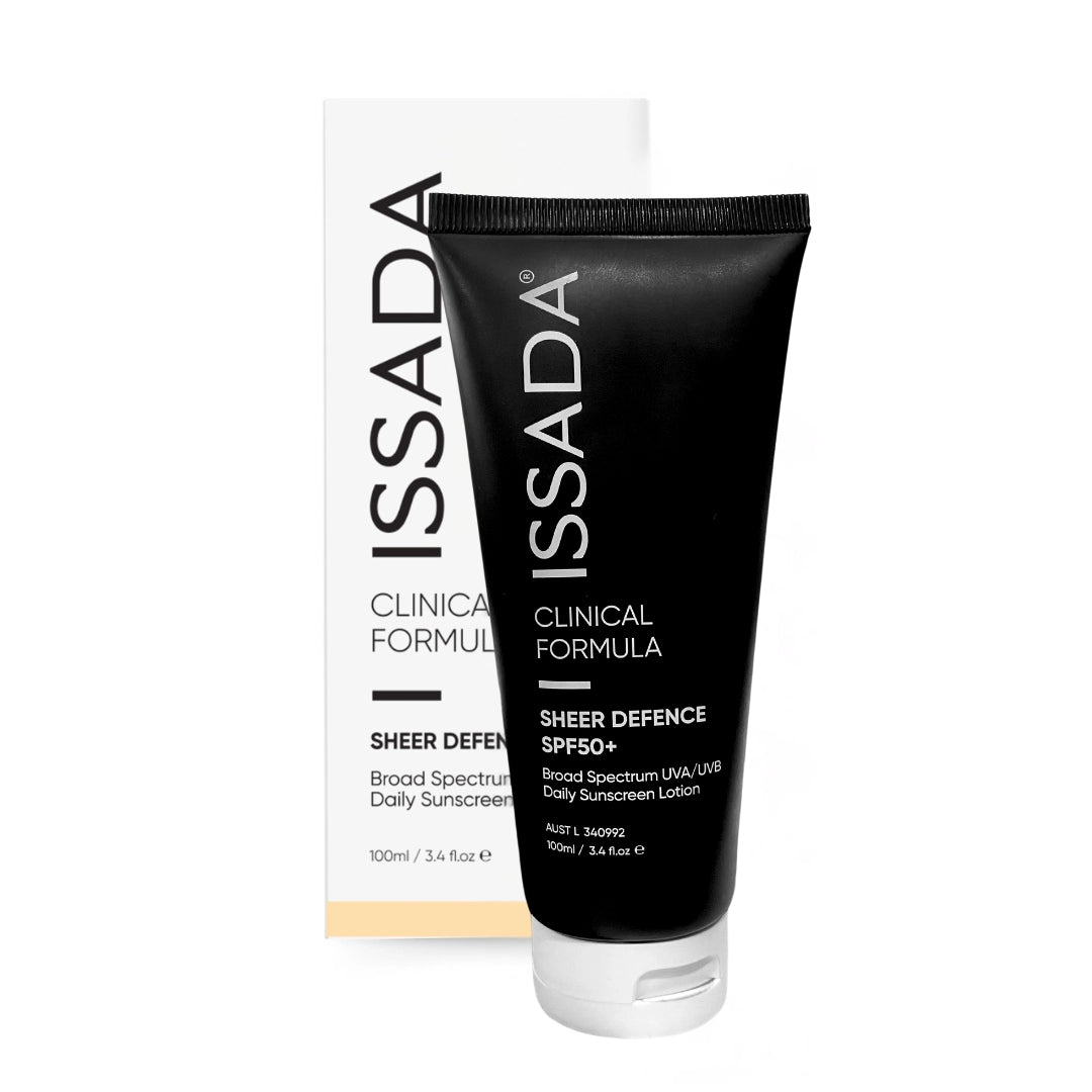 Issada Sheer Defence SPF50+ black tube sunscreen placed in front of its white and beige box packaging.