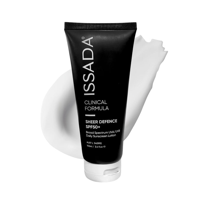 Issada Sheer Defence SPF50+ sunscreen tube with a white lotion swatch behind it on a clean white background.