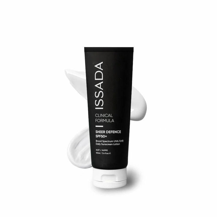 ISSADA Sheer Defence SPF50+ daily sunscreen lotion in a black tube with white cream background.