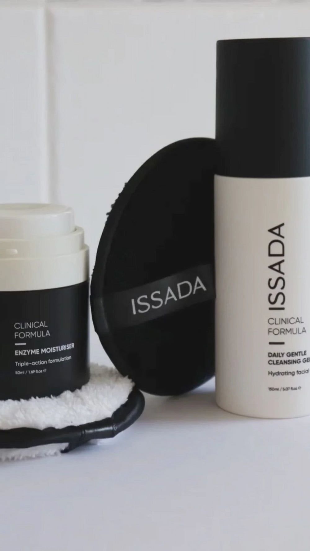ISSADA Clinical Formula Daily Gentle Cleansing Gel and Enzyme Moisturiser with reusable cleansing pads for hydrating skincare routine.