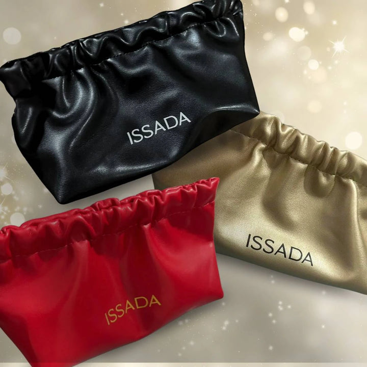 Sleek Issada slim makeup bags in black, red, and gold, designed with a soft finish and perfect for brushes and cosmetics.