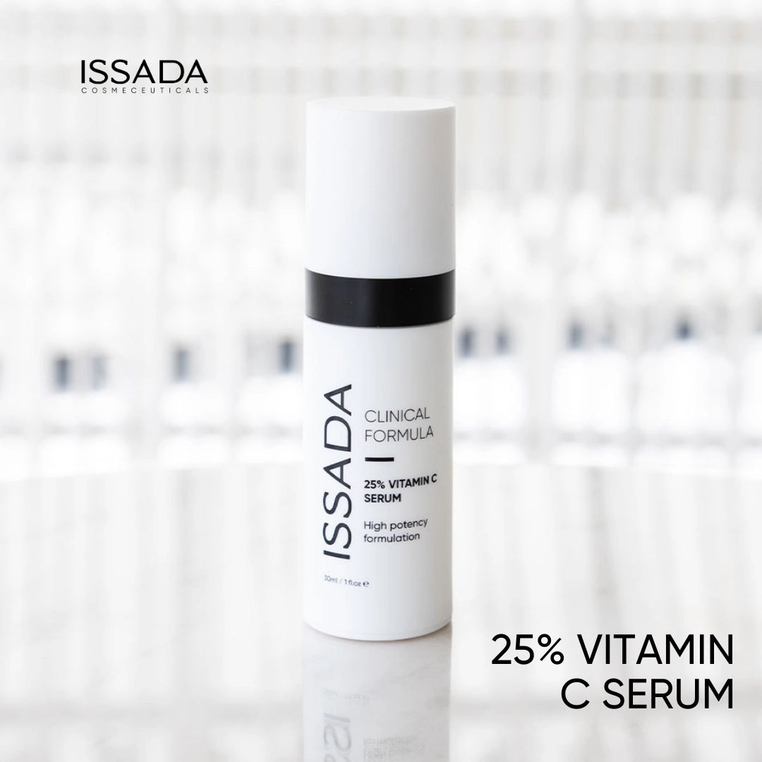 Issada 25% Vitamin C Serum bottle standing on a glossy surface with a softly blurred background, showcasing the product’s sleek clinical design.