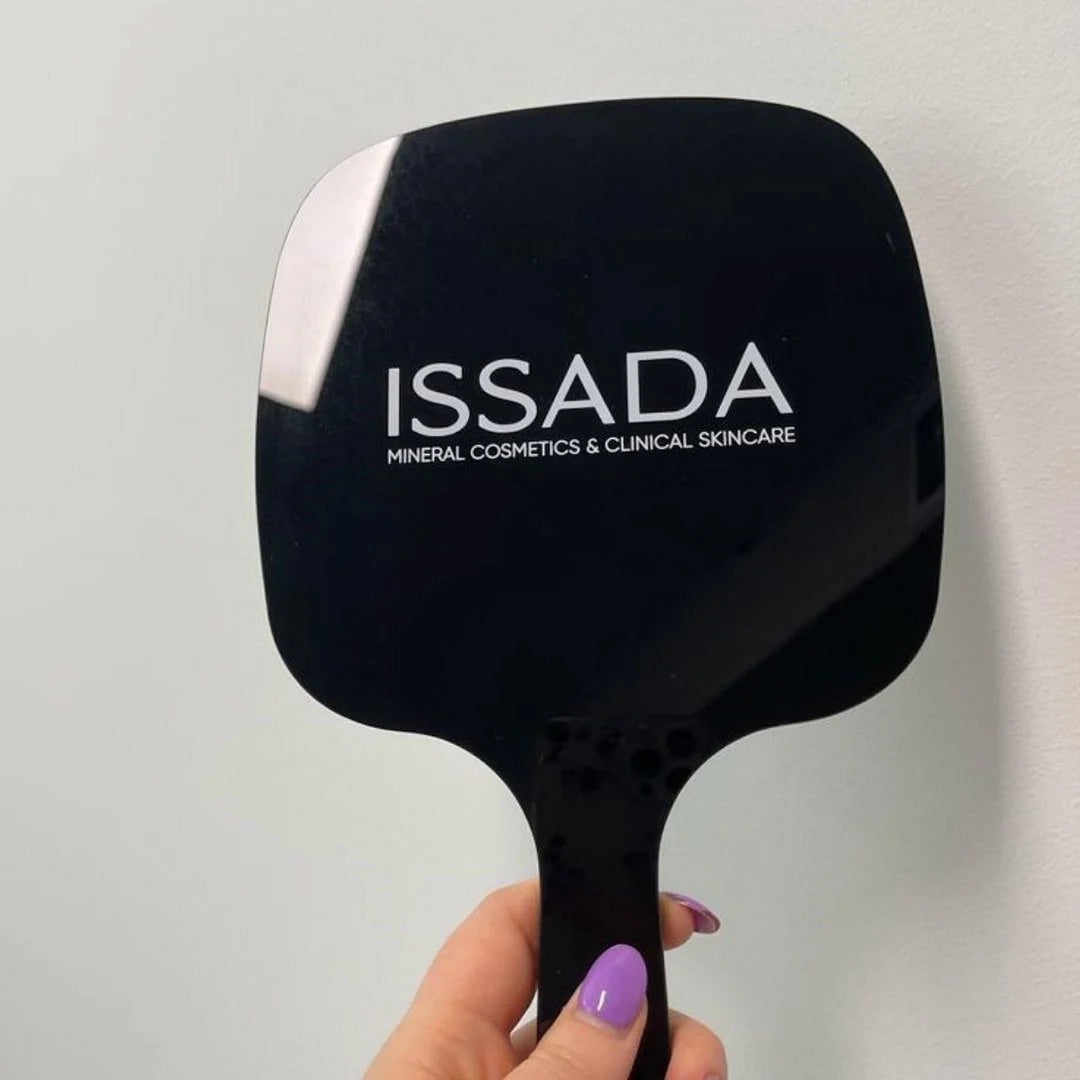 Issada black hand mirror with logo, perfect for precise makeup application and skincare routines.