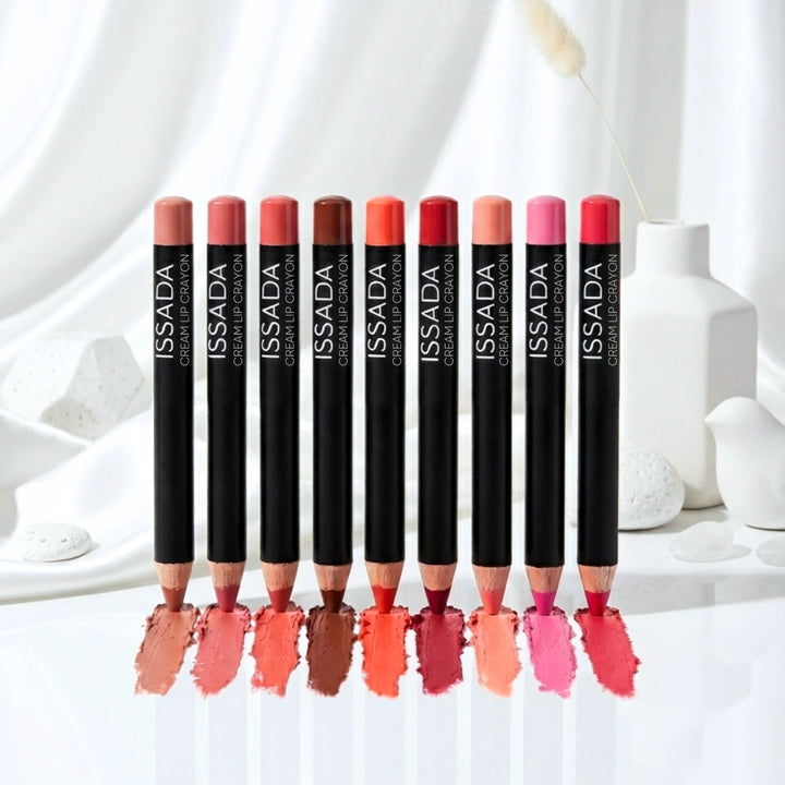 ISSADA Cream Lip Crayon pencils in varied pink, coral, red and brown shades with matching colour swatches.