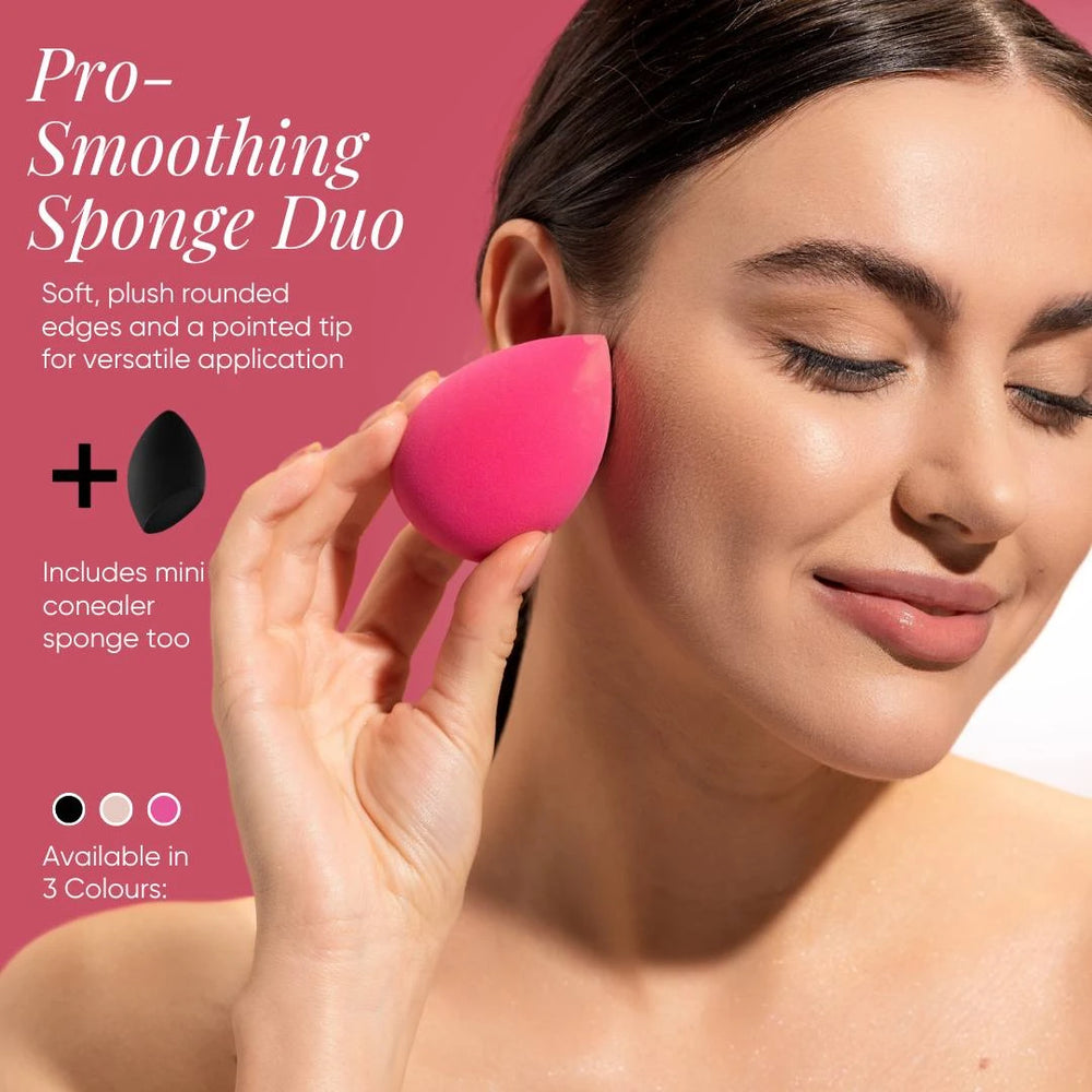 Model applying makeup with Issada Pro-Smoothing Sponge Duo, featuring a pink beauty blender with rounded edges and pointed tip for flawless foundation blending.
