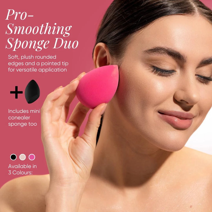 Model applying makeup with Issada Pro-Smoothing Sponge Duo, featuring a pink beauty blender with rounded edges and pointed tip for flawless foundation blending.