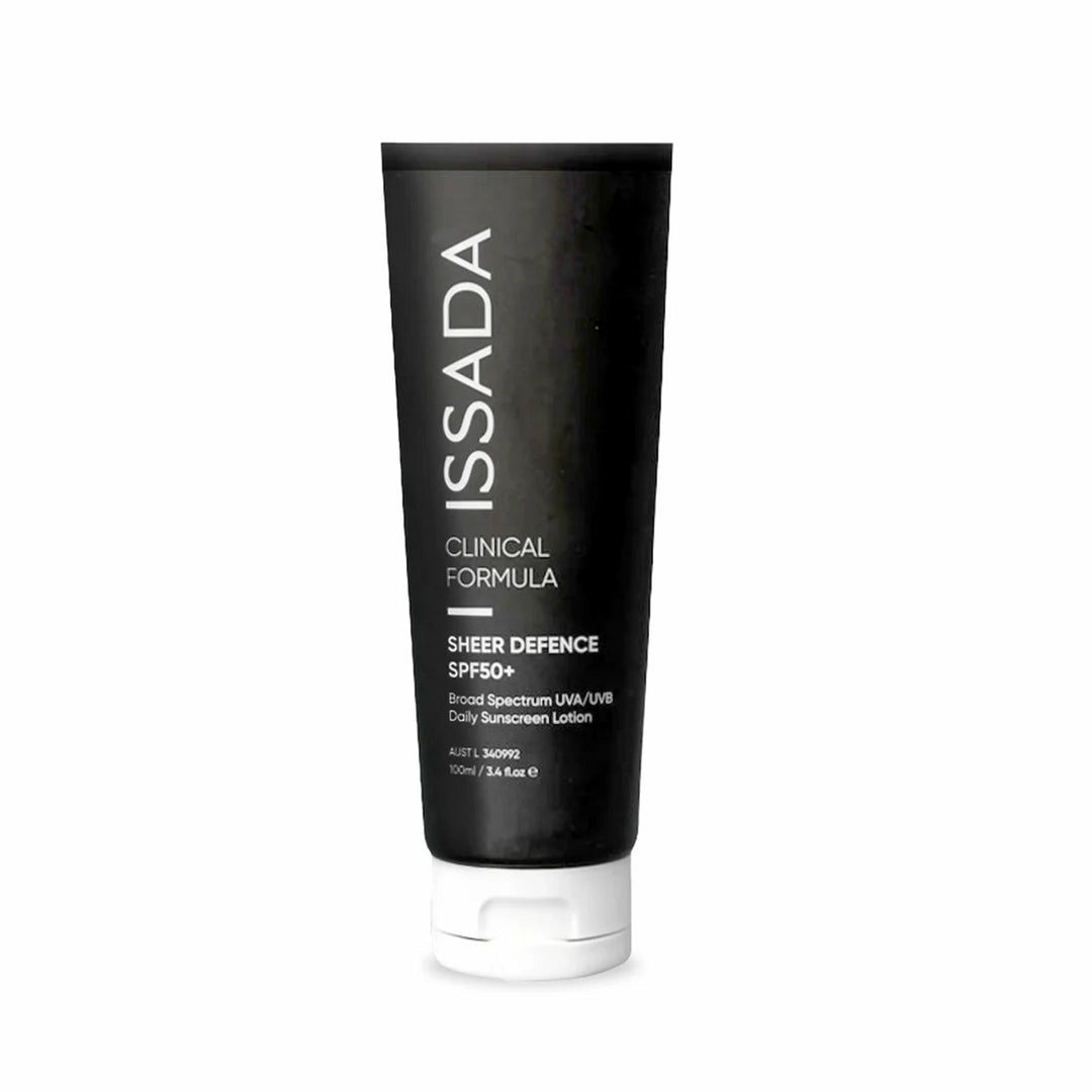 Black and white tube of ISSADA Sheer Defence SPF50+ daily sunscreen lotion against a white background.
